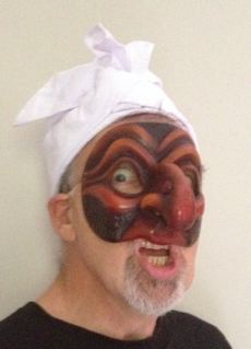 Newman wearing a handcrafted Commedia mask: Pulcinella